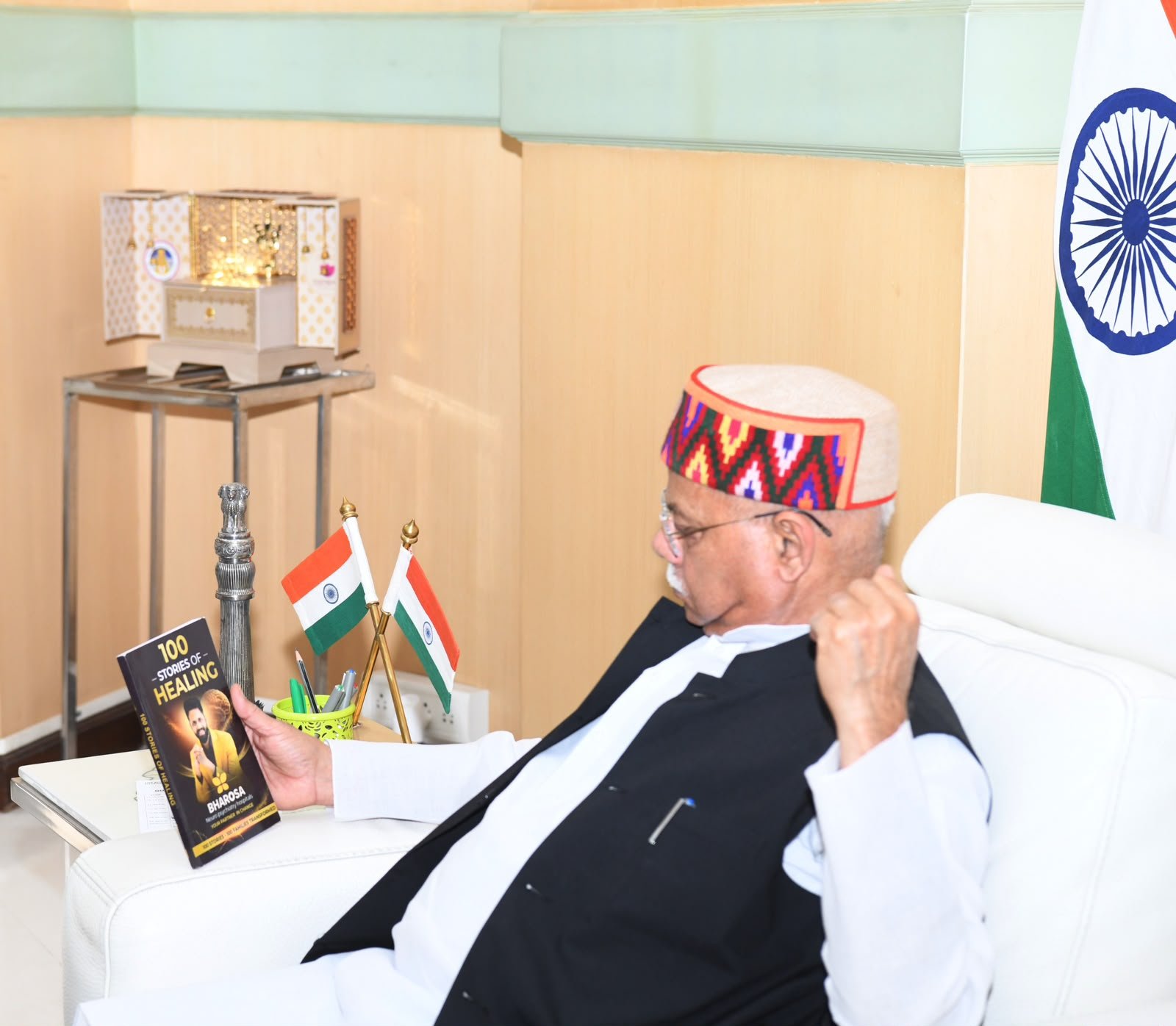 The Hon'ble Governor of Telangana reading 100 Stories of Healing